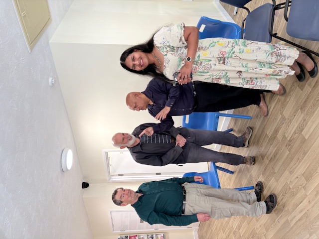 Reading Patient Voice Group officers Francis Brown and Tom Lake at the Coley Park surgery on the open day with practice manager Kamlesh Patel and Dr Magesh Arthanari.